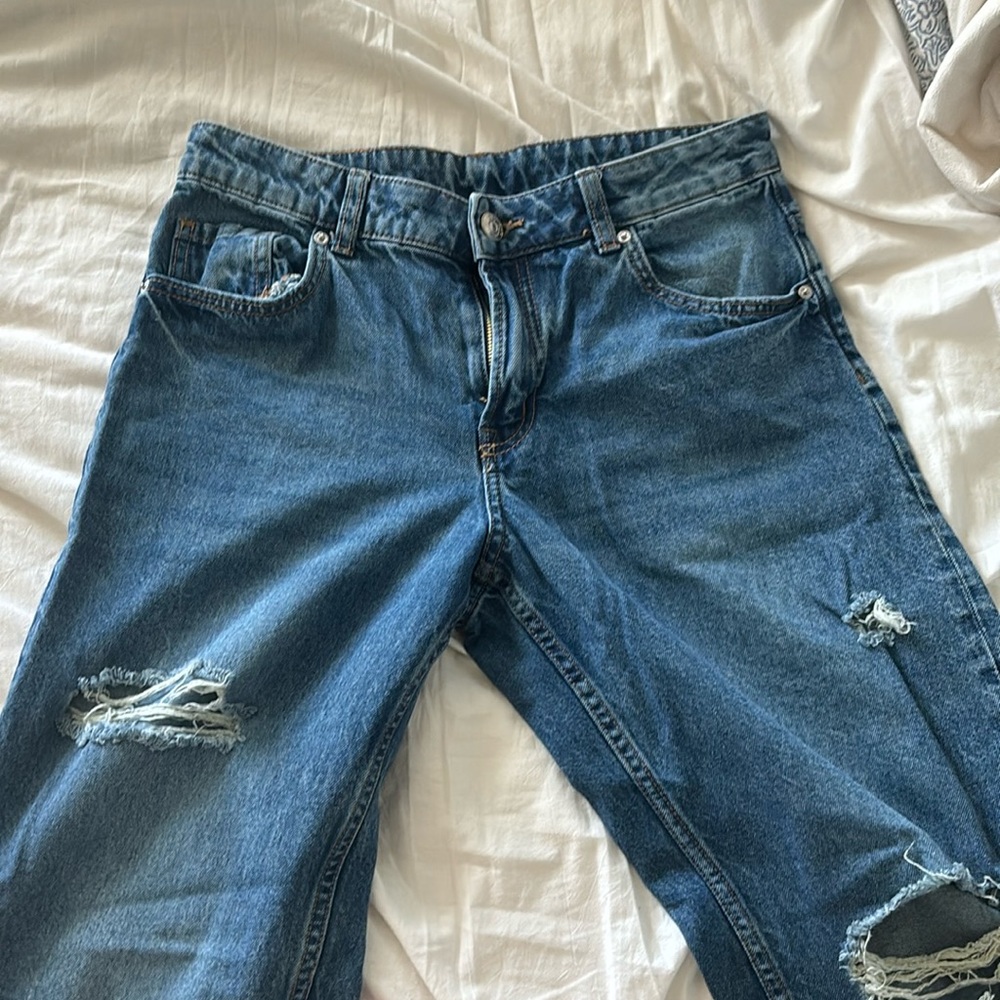 Mid rise blue baggy ripped jeans